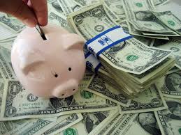 Piggy Bank among dollar bills